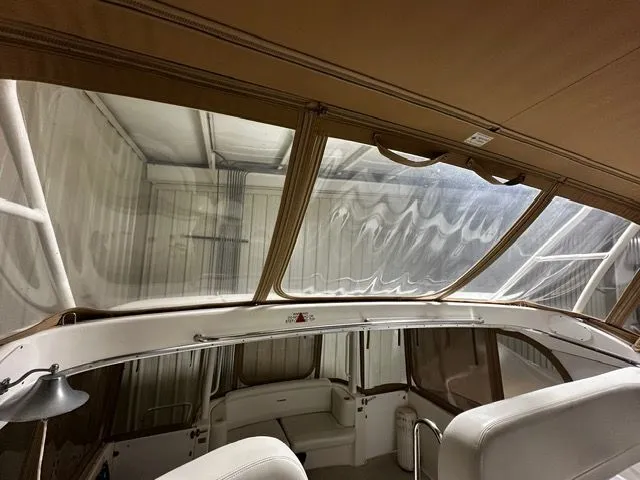 Slide: The Image of Interior of a 2002 Silverton 39 Motor Yacht, featuring seating area. - 49