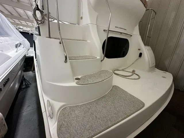Slide: The Image of 2002 Silverton 39 Motor Yacht with steps and carpeted flooring. - 5
