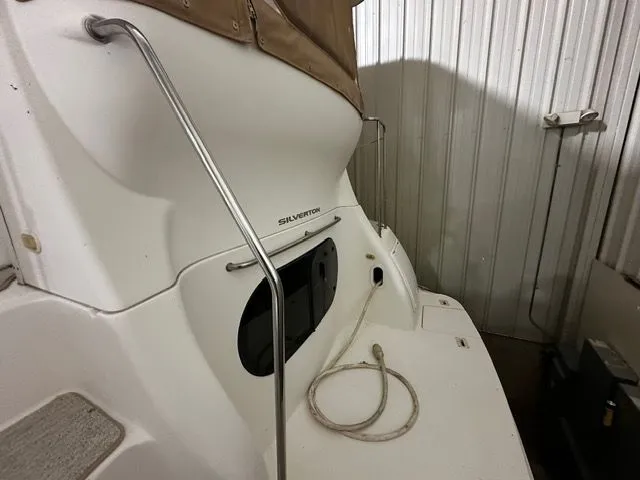 Slide: The Image of Rear view of a 2002 Silverton 39 Motor Yacht in storage. - 7