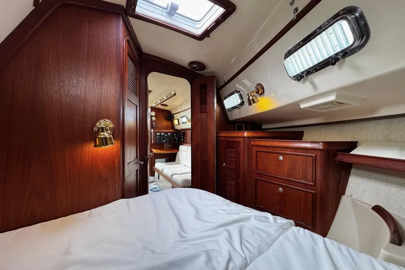 Slide: The Image of Interior of 1998 Island Packet 350 sailboat with wooden cabinetry and seating. - 37