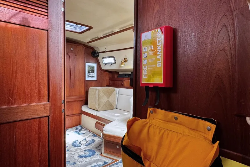 Slide: The Image of Interior cabin of a 1998 Island Packet 350 sailboat, featuring cozy sleeping quarters. - 46