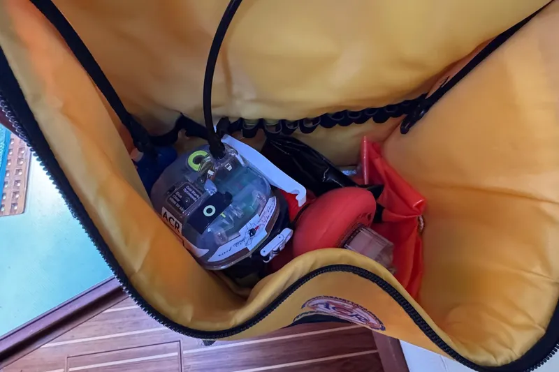 Slide: The Image of Interior cabin of a 1998 Island Packet 350 sailboat with cushioned seating. - 47