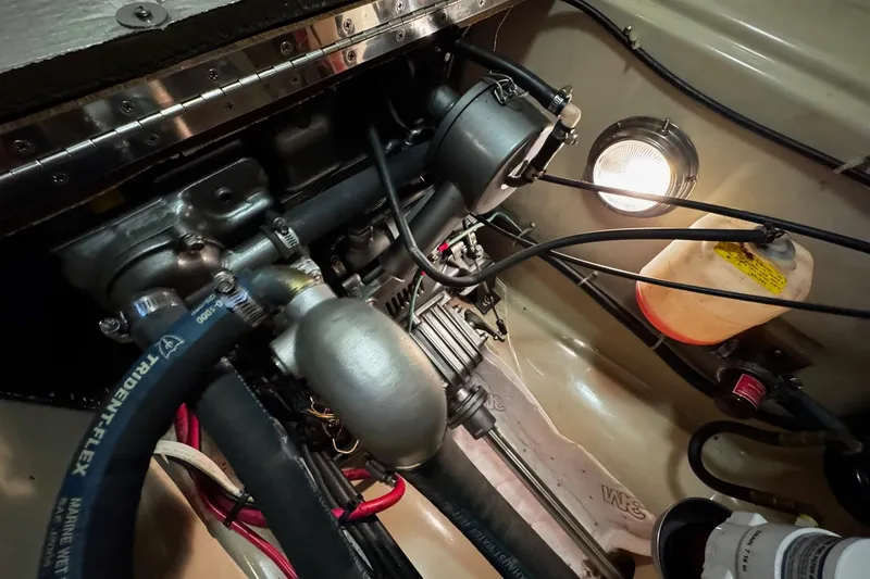 Slide: The Image of Safety equipment inside a yellow bag on a 1998 Island Packet 350 sailboat. - 49