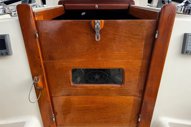 Slide: The Image of Open wooden hatch on 1998 Island Packet 350 sailboat, revealing interior cabin. - 5