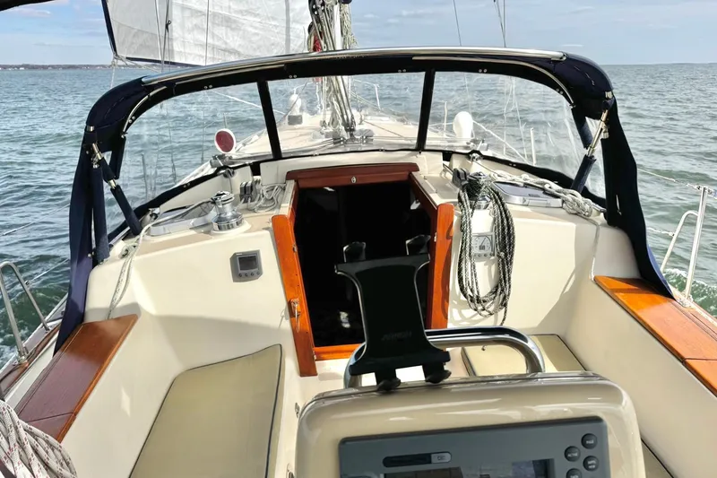 Slide: The Image of Engine compartment of a 1998 Island Packet 350 sailboat, showcasing mechanical components. - 53