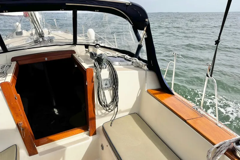 Slide: The Image of Cockpit view of a 1998 Island Packet 350 sailboat on open water. - 55
