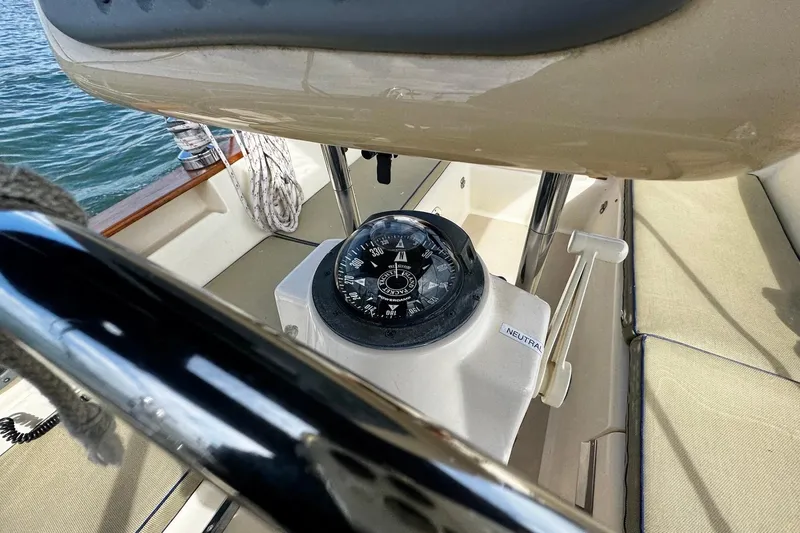 Slide: The Image of Sailing on a 1998 Island Packet 350 with American flag, open sea view. - 59