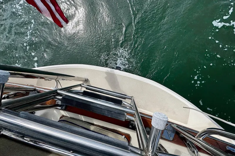 Slide: The Image of 1998 Island Packet 350 sailboat cockpit with navigation equipment and seating. - 63