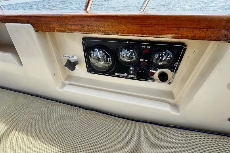 Slide: The Image of Aft view from 1998 Island Packet 350 sailboat with American flag over water. - 65