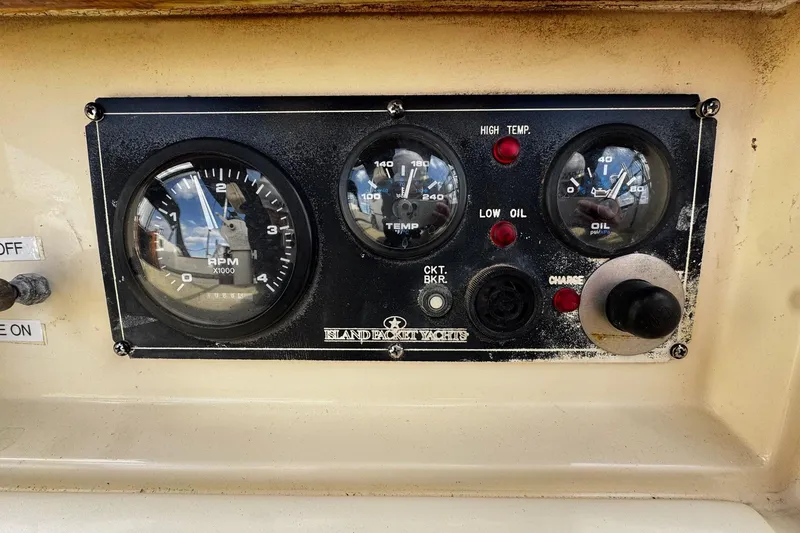 Slide: The Image of Cockpit view of 1998 Island Packet 350 sailboat with ocean waves in background. - 66