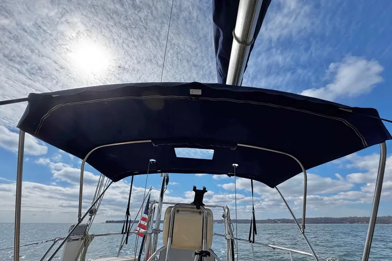 Slide: The Image of Cockpit of 1998 Island Packet 350 sailboat with winch and ropes. - 76