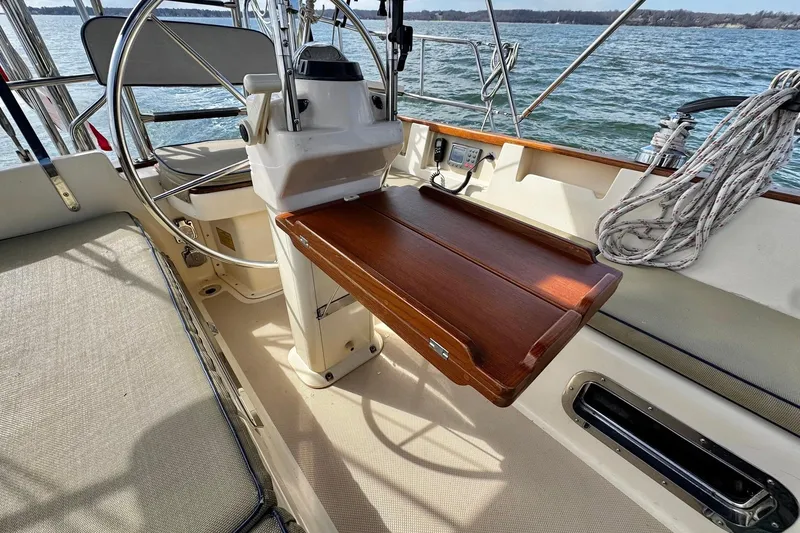 Slide: The Image of Cockpit view from a 1998 Island Packet 350 sailboat on open water. - 77