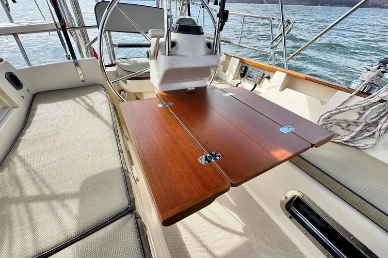 Slide: The Image of Sailing on a 1998 Island Packet 350 under a sunny sky with a bimini top. - 78