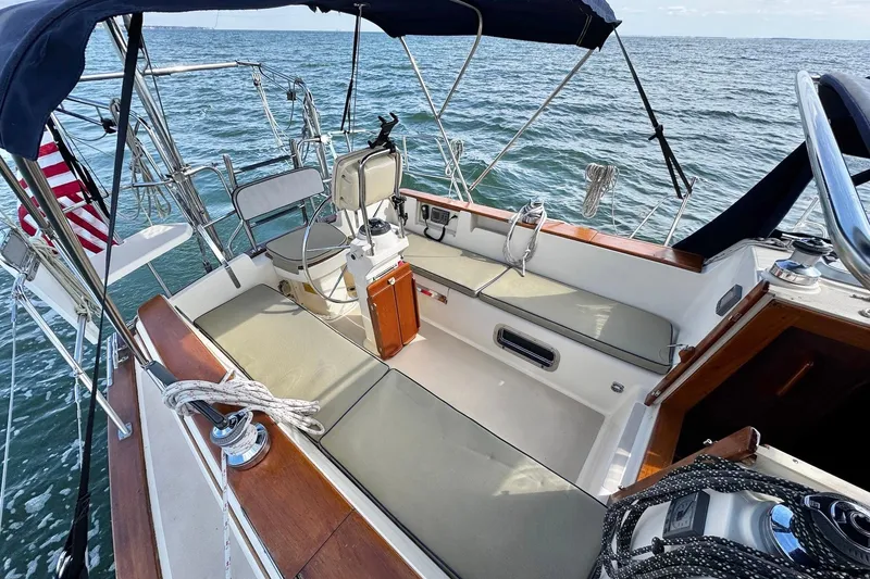 Slide: The Image of Sailing on a 1998 Island Packet 350 yacht with blue skies and calm waters. - 82