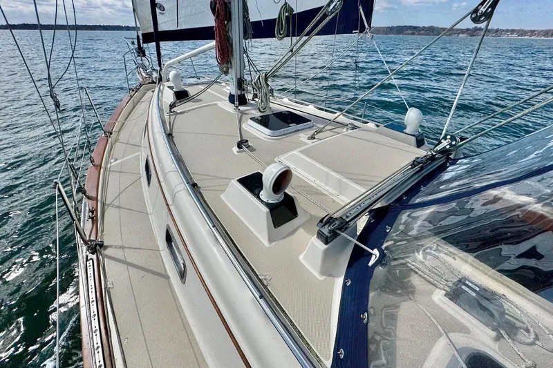Slide: The Image of Sail of a 1998 Island Packet 350 yacht against a blue sky. - 83