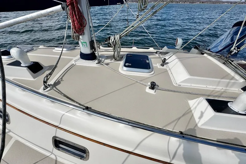 Slide: The Image of 1998 Island Packet 350 sailboat deck with rigging on open water. - 85
