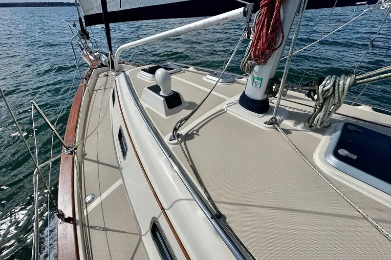 Slide: The Image of 1998 Island Packet 350 sailboat deck with blue canopy on open water. - 86