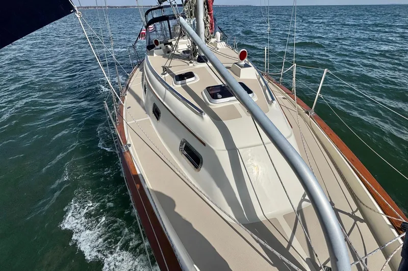 Slide: The Image of Sailing on a 1998 Island Packet 350 yacht with sails unfurled on a sunny day. - 89