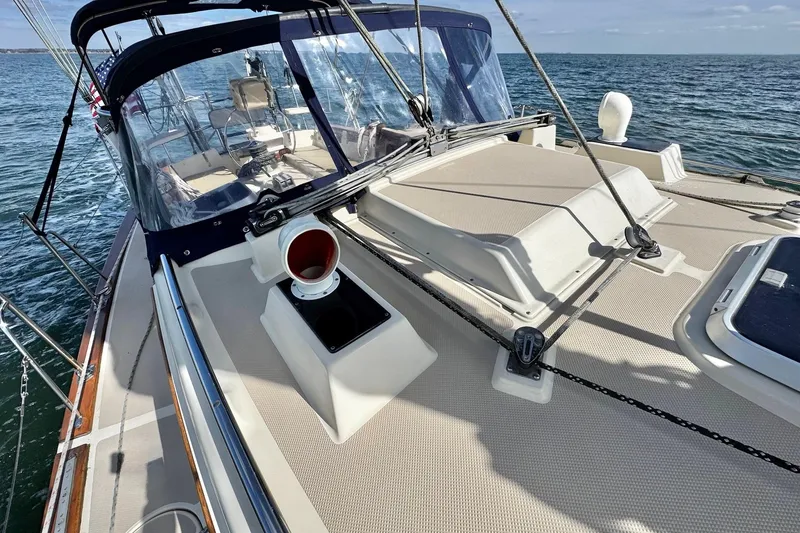 Slide: The Image of 1998 Island Packet 350 sailboat cruising on open water, showcasing deck and rigging. - 91