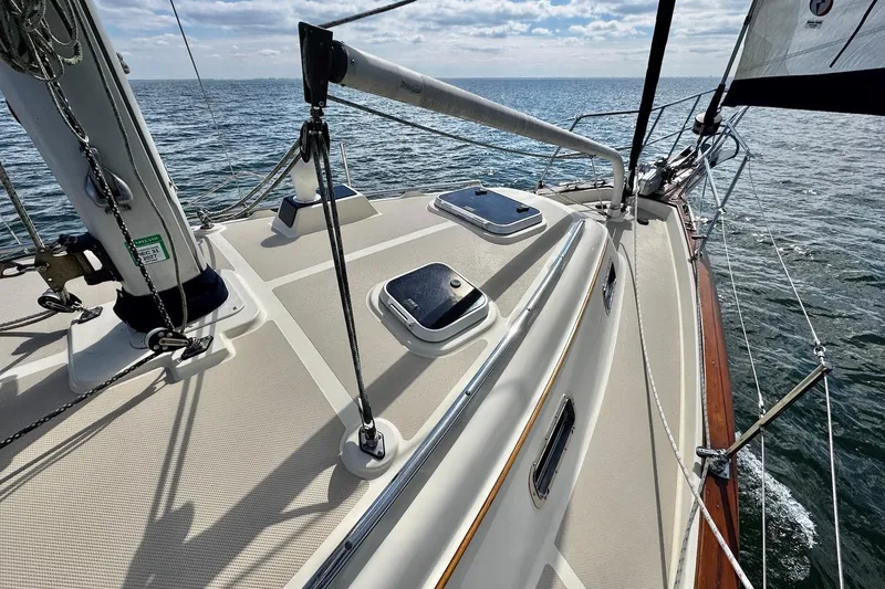 Slide: The Image of Sailing on a 1998 Island Packet 350 yacht, open sea view, clear skies. - 92