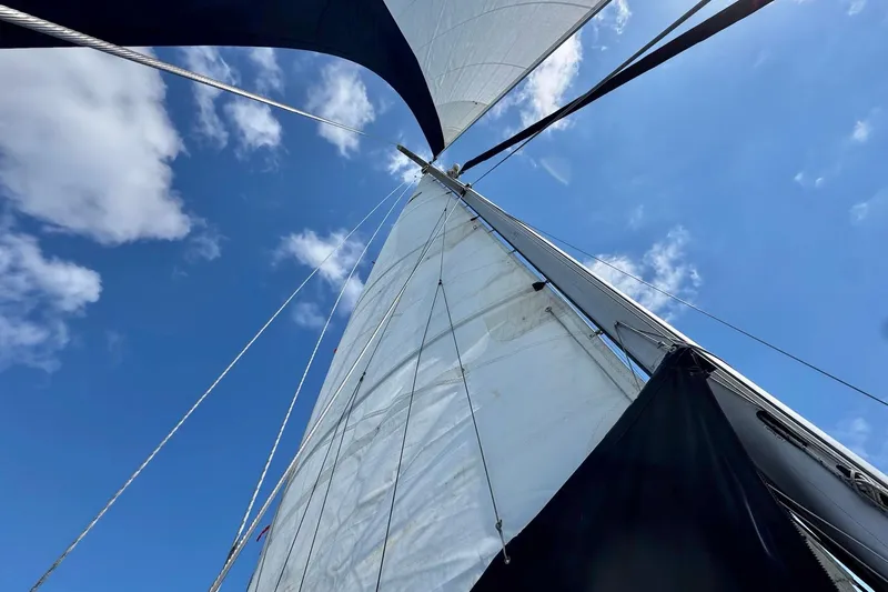 Slide: The Image of 1998 Island Packet 350 sailboat deck with clear skies and ocean view. - 93