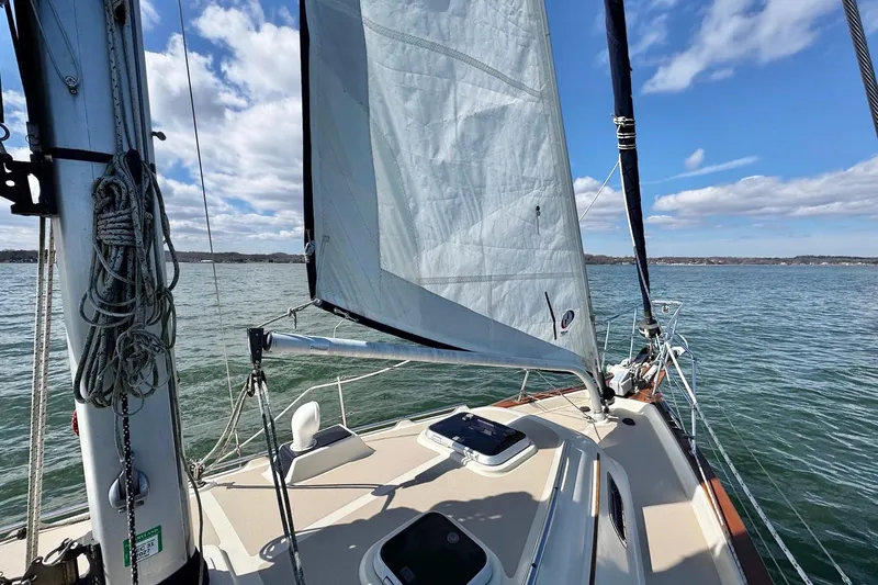 Slide: The Image of 1998 Island Packet 350 sailboat deck with ocean view and clear sky. - 94