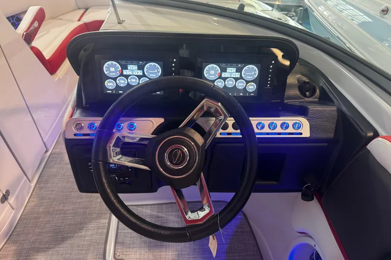 Slide: The Image of 2024 Crownline 250 XSS dashboard with dual displays and illuminated controls. - 4