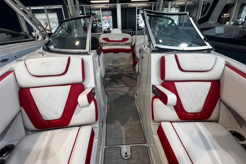 Slide: The Image of 2024 Crownline 250 XSS boat interior with red and white seating, modern design. - 7