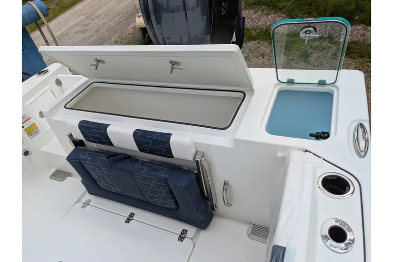 Slide: The Image of 2026 Parker 227 Explorer boat interior with storage compartments and seating. - 10
