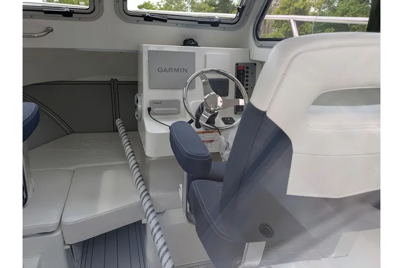 Slide: The Image of Interior of 2026 Parker 227 Explorer boat with Garmin navigation system. - 12
