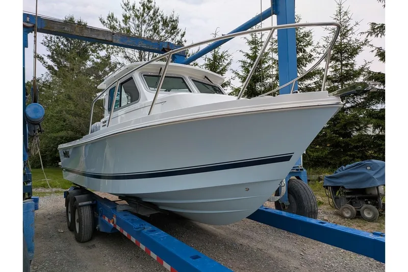 Slide: The Image of 2026 Parker 227 Explorer boat on trailer, ready for launch. - 2
