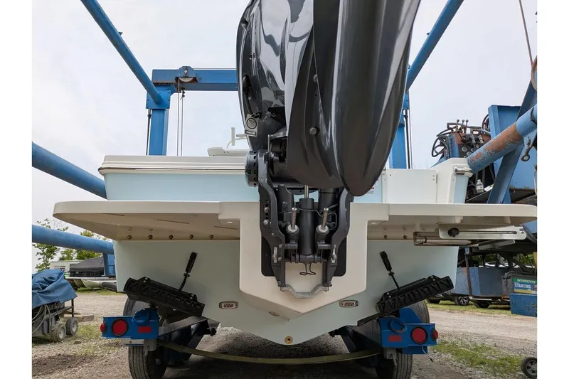 Slide: The Image of Rear view of a 2026 Parker 227 Explorer boat on a trailer. - 4