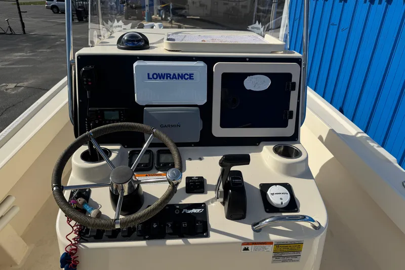 Slide: The Image of 2011 Parker 2300 Special Edition boat console with Lowrance and Garmin navigation systems. - 13