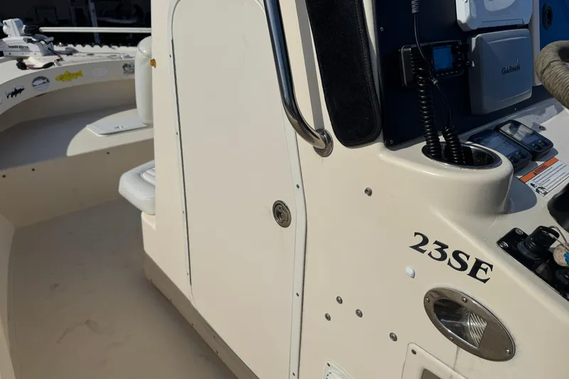 Slide: The Image of 2011 Parker 2300 Special Edition boat interior with control panel and seating. - 14