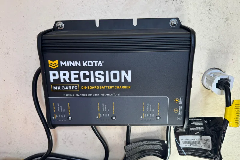 Slide: The Image of Minn Kota Precision MK 345PC on-board battery charger, 3 banks, 15 amps per bank. - 17