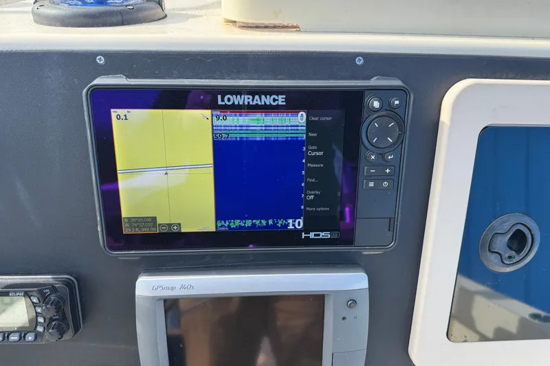 Slide: The Image of Lowrance HDS9 marine display on 2011 Parker 2300 Special Edition boat dashboard. - 21