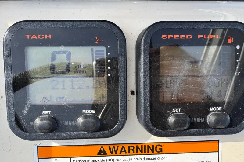 Slide: The Image of Digital gauges on a 2011 Parker 2300 Special Edition boat dashboard. - 22