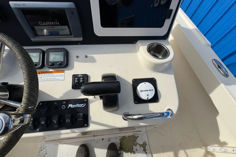 Slide: The Image of Control panel of a 2011 Parker 2300 Special Edition boat with Garmin GPS and Minn Kota controls. - 24