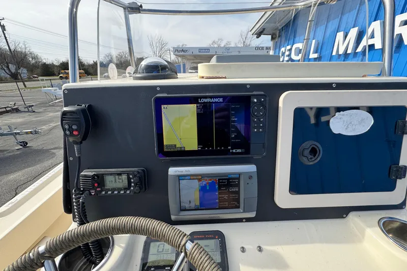 Slide: The Image of Console of a 2011 Parker 2300 Special Edition boat with navigation equipment. - 26