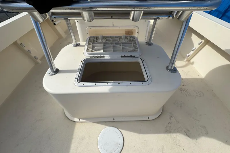 Slide: The Image of Open storage compartment on 2011 Parker 2300 Special Edition boat deck. - 28