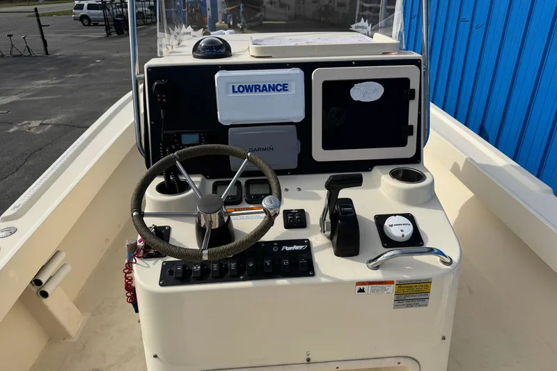 Slide: The Image of Steering console of a 2011 Parker 2300 Special Edition boat with navigation equipment. - 29