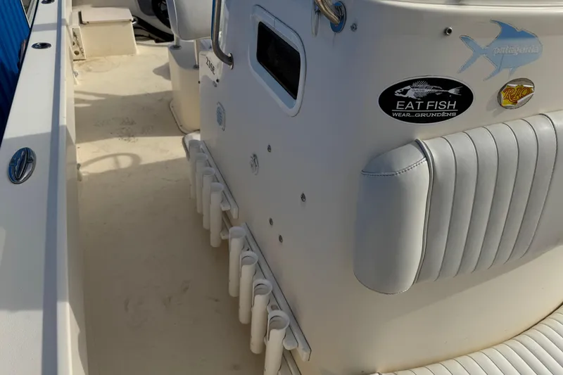 Slide: The Image of 2011 Parker 2300 Special Edition boat interior with fishing rod holders and decals. - 31