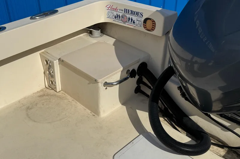 Slide: The Image of Parker 2300 Special Edition boat interior, featuring engine and "Hooks for Heroes" decal. - 6