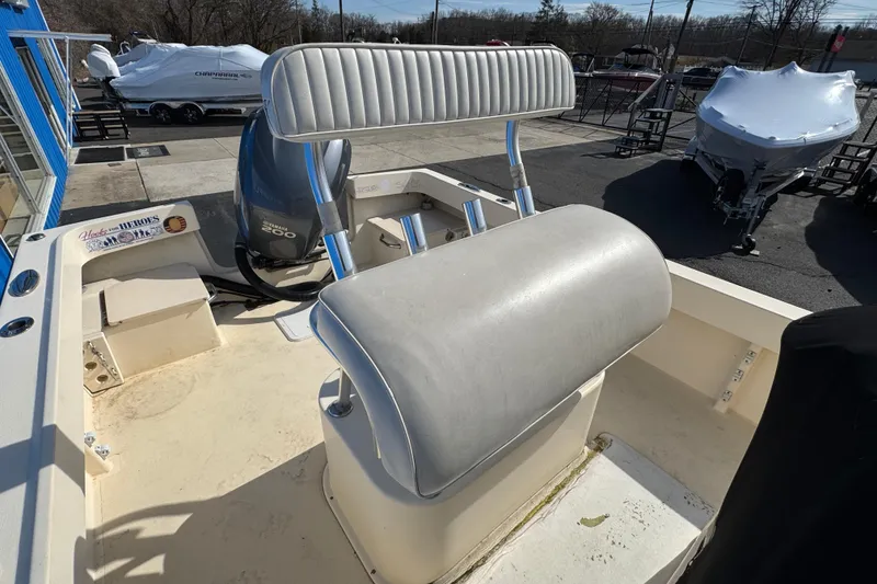 Slide: The Image of 2011 Parker 2300 Special Edition boat with Yamaha 200 engine, docked outdoors. - 9