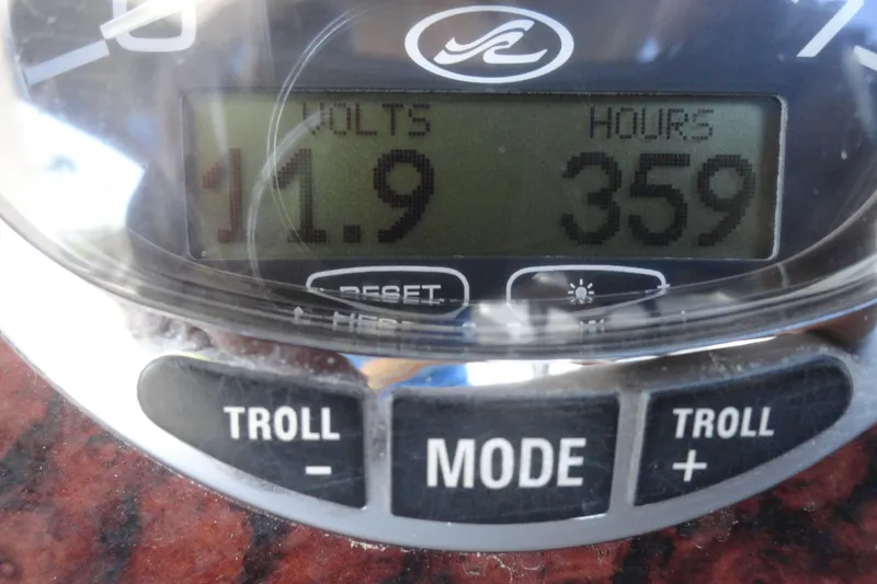 Slide: The Image of Close-up of a 2004 Sea Ray Sundancer 280 dashboard showing 11.9 volts and 359 hours. - 10