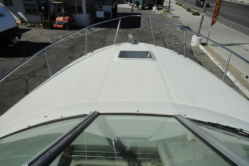 Slide: The Image of 2004 Sea Ray Sundancer 280 boat deck view at a marina. - 17