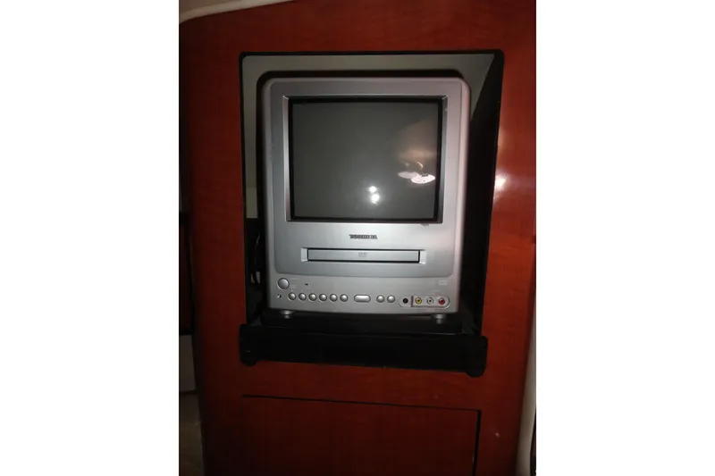 Slide: The Image of Built-in TV and DVD player on a 2004 Sea Ray Sundancer 280 yacht. - 24