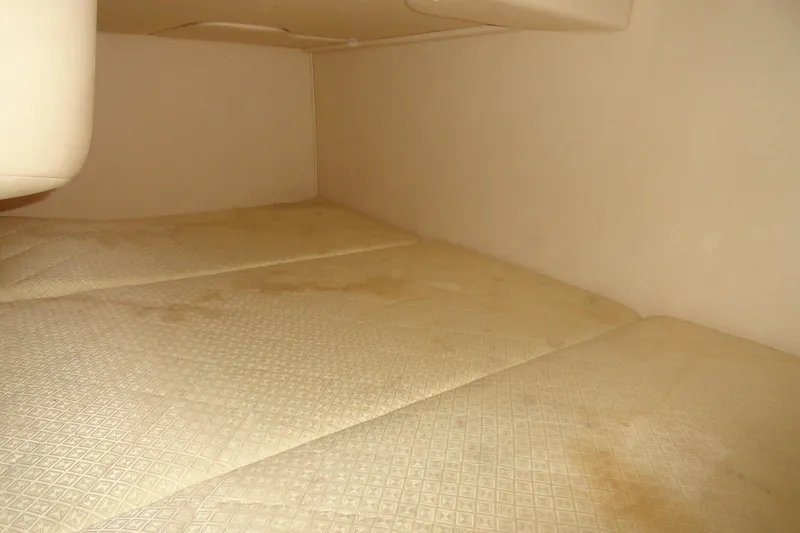 Slide: The Image of Interior cabin of 2004 Sea Ray Sundancer 280 with beige upholstery. - 26