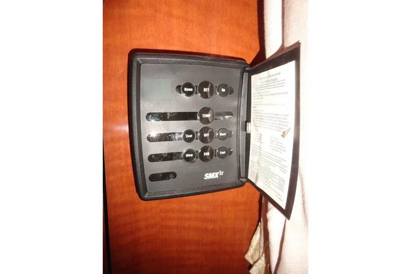 Slide: The Image of SMXir control panel on 2004 Sea Ray Sundancer 280 boat interior. - 28