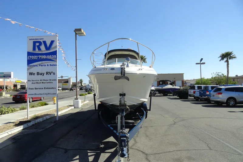 Slide: The Image of 2004 Sea Ray Sundancer 280 boat on trailer at RV dealership parking lot. - 3
